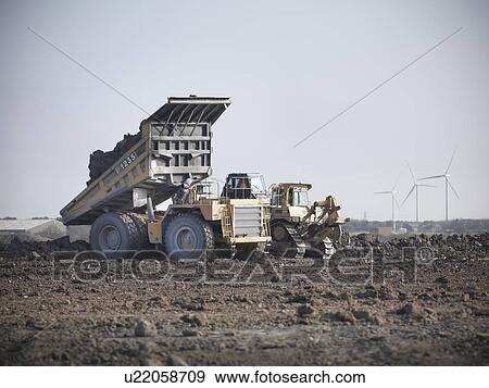 Stock Photo - Construction equipment at coal mine. Fotosearch