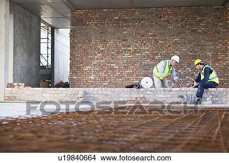 Picture - Construction worker on building site. Fotosearch