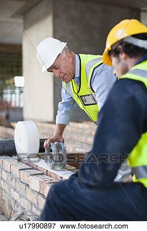 Stock Photo - Construction worker on building site. Fotosearch
