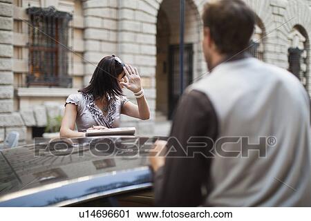 Couple arguing over sports car View Large Photo Image Stock Image - Couple arguing over sports car. Fotosearch