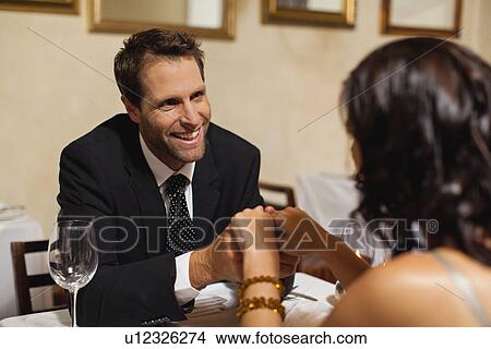Picture - Couple having dinner in restaurant. Fotosearch