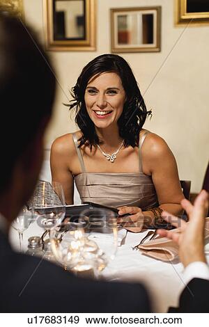 Couple having dinner in restaurant View Large Photo Image Stock Photo - Couple having dinner in restaurant. Fotosearch