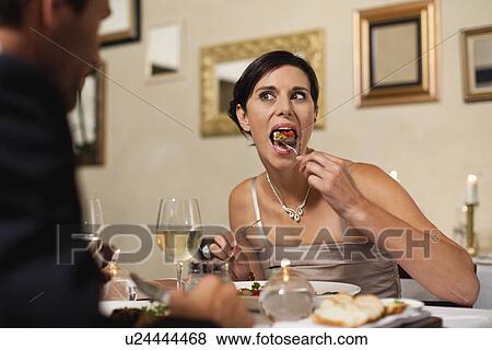 Couple having dinner in restaurant View Large Photo Image Stock Photo - Couple having dinner in restaurant. Fotosearch