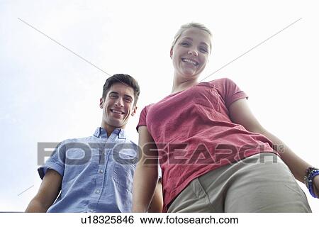 Stock Photograph - Couple holding hands on city street. Fotosearch