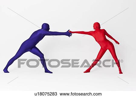 Couple in bodysuits reaching View Large Photo Image Stock Image - Couple in bodysuits reaching. Fotosearch