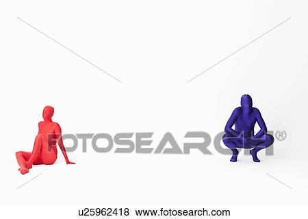 Stock Photo - Couple in bodysuits sitting on floor. Fotosearch