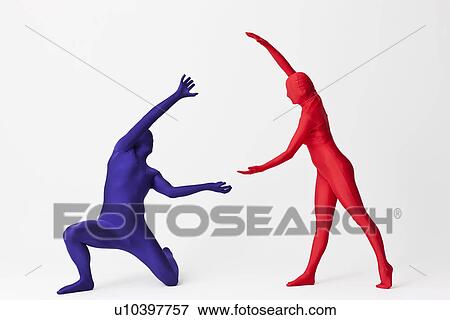Stock Photo - Couple in bodysuits with invisible globe. Fotosearch