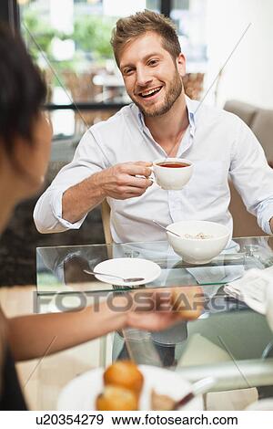 Couple talking at breakfast View Large Photo Image Stock Photo - Couple talking at breakfast. Fotosearch