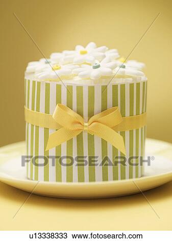 Stock Image - Decorated cookies in ornate tin. Fotosearch