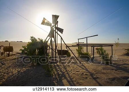 Stock Image - Dilapidated windmill in desert oasis, Canoa Quebrada, Fortaleza, Brazil. Fotosearch