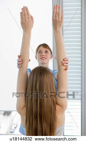 Doctor examining girls arms in office View Large Photo Image Stock Image - Doctor examining girls arms in office. Fotosearch