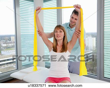 Doctor examining womans arms in office View Large Photo Image Stock Image - Doctor examining womans arms in office. Fotosearch