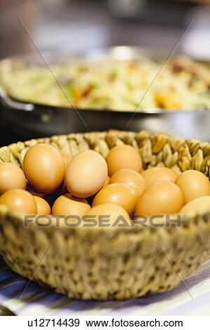 Stock Photo - Eggs and seafood paella. Fotosearch
