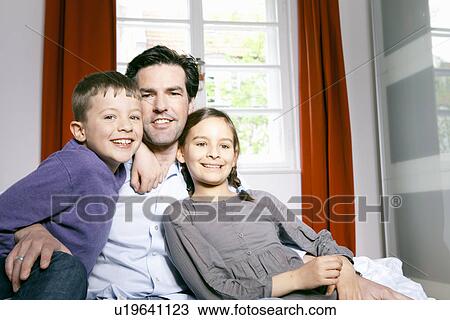 Father and children smiling together View Large Photo Image Stock Image - Father and children smiling together. Fotosearch