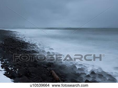 Fog rolling over rocks on beach View Large Photo Image Picture - Fog rolling over rocks on beach. Fotosearch