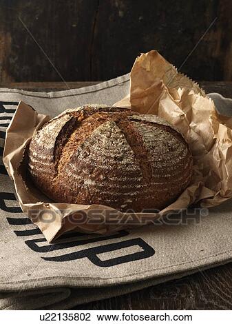 Fresh baked bread in paper View Large Photo Image Stock Image - Fresh baked bread in paper. Fotosearch