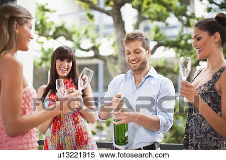 Stock Photography - Friends drinking champagne together. Fotosearch
