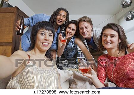 Friends taking pictures of themselves View Large Photo Image Stock Photo - Friends taking pictures of themselves. Fotosearch
