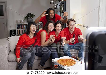Stock Photo - Friends watching sports on television. Fotosearch