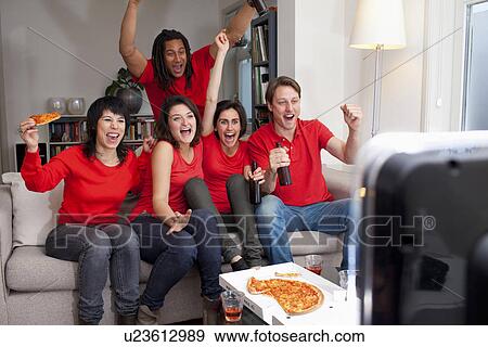 Stock Photo - Friends watching sports on television. Fotosearch