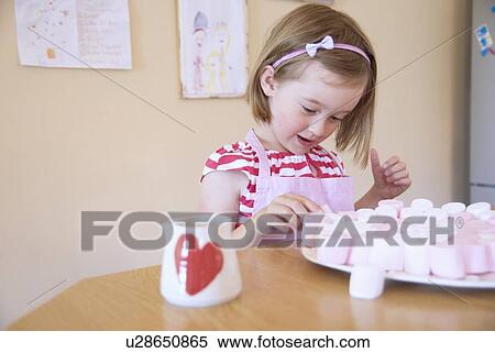 Girl baking in kitchen View Large Photo Image Stock Photography - Girl baking in kitchen. Fotosearch