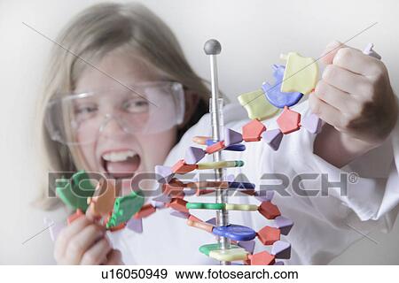 Girl breaking molecular model View Large Photo Image Stock Photo - Girl breaking molecular model. Fotosearch