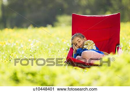 Girl in costume sleeping in chair View Large Photo Image Stock Image - Girl in costume sleeping in chair. Fotosearch