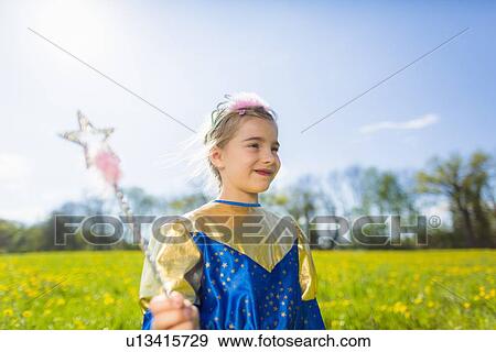 Girl wearing fairy costume outdoors View Large Photo Image Stock Photo - Girl wearing fairy costume outdoors. Fotosearch