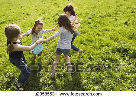 Girls playing in circle outdoors View Large Photo Image Stock Image - Girls playing in circle outdoors. Fotosearch