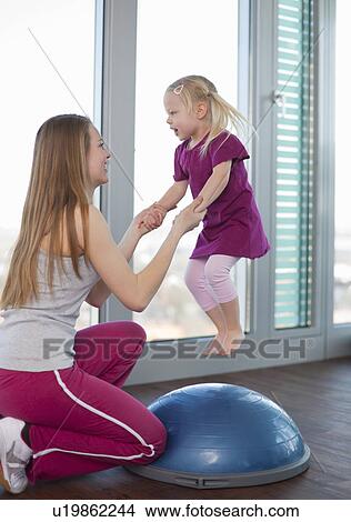 Girls playing with trampoline in gym View Large Photo Image Picture - Girls playing with trampoline in gym. Fotosearch