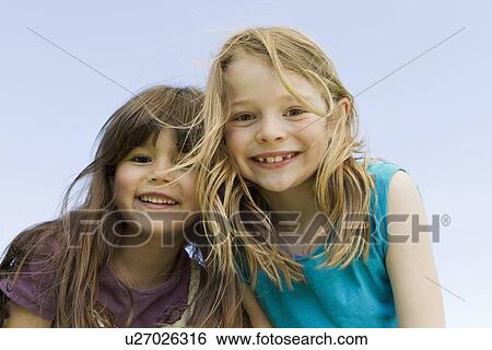 Girls smiling together outdoors View Large Photo Image Stock Photograph - Girls smiling together outdoors. Fotosearch