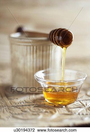 Honey dripping from spoon View Large Photo Image Stock Image - Honey dripping from spoon. Fotosearch