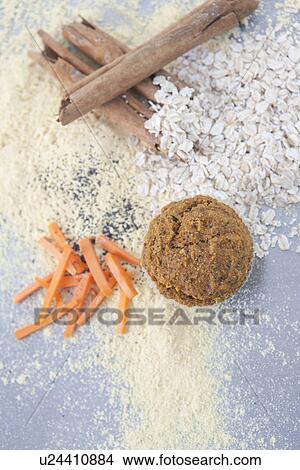 Picture - Ingredients for vegan muffin - Cinnamon, quinoa flour, carrots, oats. Fotosearch
