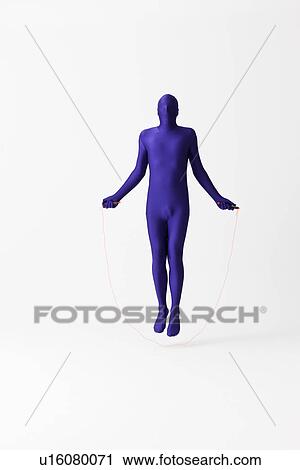 Stock Image - Man in bodysuit jumping rope. Fotosearch