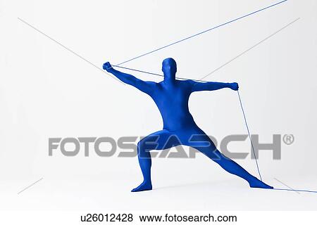 Stock Photo - Man in bodysuit playing with string. Fotosearch
