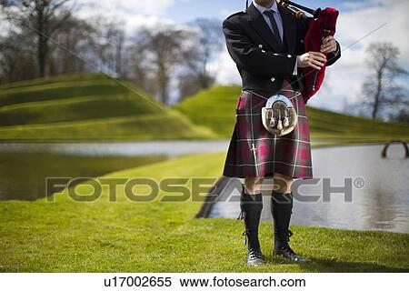 Man in Scottish kilt playing bagpipes View Large Photo Image Stock Photography - Man in Scottish kilt playing bagpipes. Fotosearch
