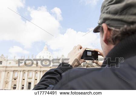 Man taking picture of St Peter's Basilica, St Peter's Square, Vatican City View Large Photo Image Stock Image - Man taking picture of St Peter's Basilica, St Peter's Square, Vatican City. Fotosearch