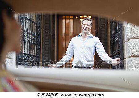 Stock Photo - Man talking to girlfriend in car. Fotosearch