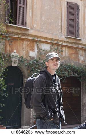 Man walking on village street View Large Photo Image Stock Photography - Man walking on village street. Fotosearch