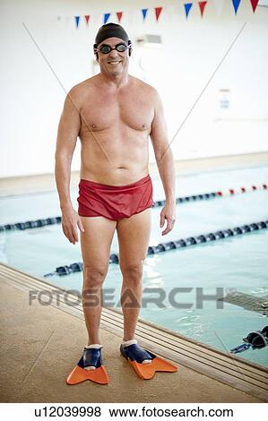 Man wearing swim gear at pool View Large Photo Image Stock Photo - Man wearing swim gear at pool. Fotosearch
