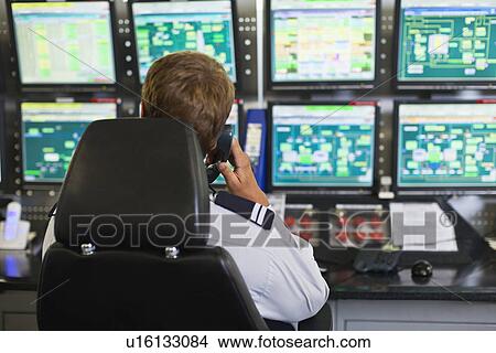 Man working in security control room View Large Photo Image Picture - Man working in security control room. Fotosearch