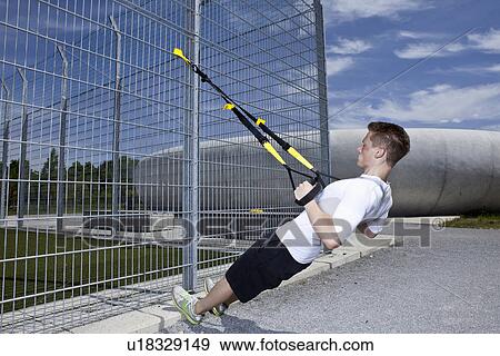 Man working out in industrial area View Large Photo Image Stock Photo - Man working out in industrial area. Fotosearch