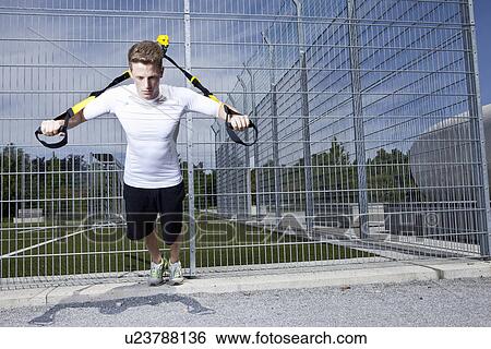 Man working out in industrial area View Large Photo Image Stock Photograph - Man working out in industrial area. Fotosearch