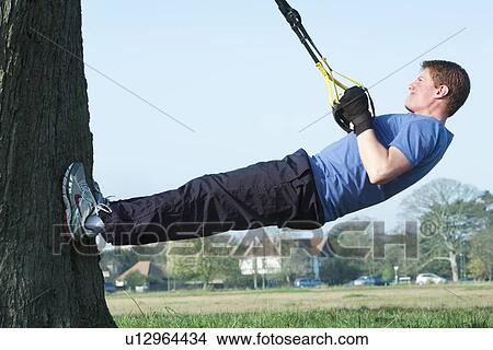 Picture - Man working out outdoors. Fotosearch