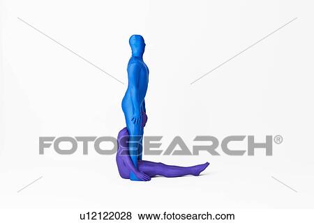 Stock Photo - Men in bodysuits making the letter L. Fotosearch