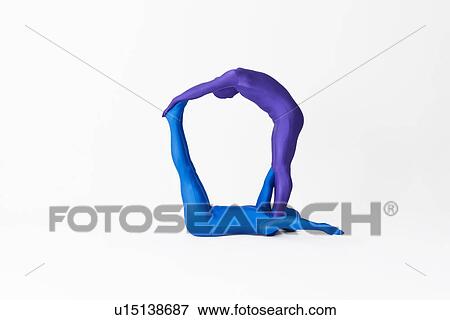 Stock Photo - Men in bodysuits making the letter Q. Fotosearch