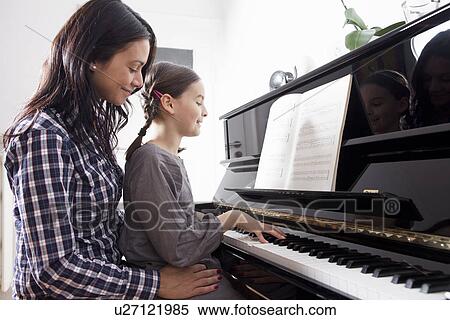 Mother and daughter sitting at piano View Large Photo Image Stock Photography - Mother and daughter sitting at piano. Fotosearch