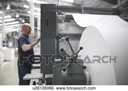 Paper feed of printing press View Large Photo Image Stock Photograph - Paper feed of printing press. Fotosearch