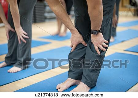 People practicing yoga in studio View Large Photo Image Stock Photo - People practicing yoga in studio. Fotosearch