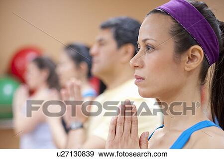 People practicing yoga in studio View Large Photo Image Stock Photo - People practicing yoga in studio. Fotosearch